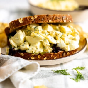 Egg salad sandwich served on a plate.