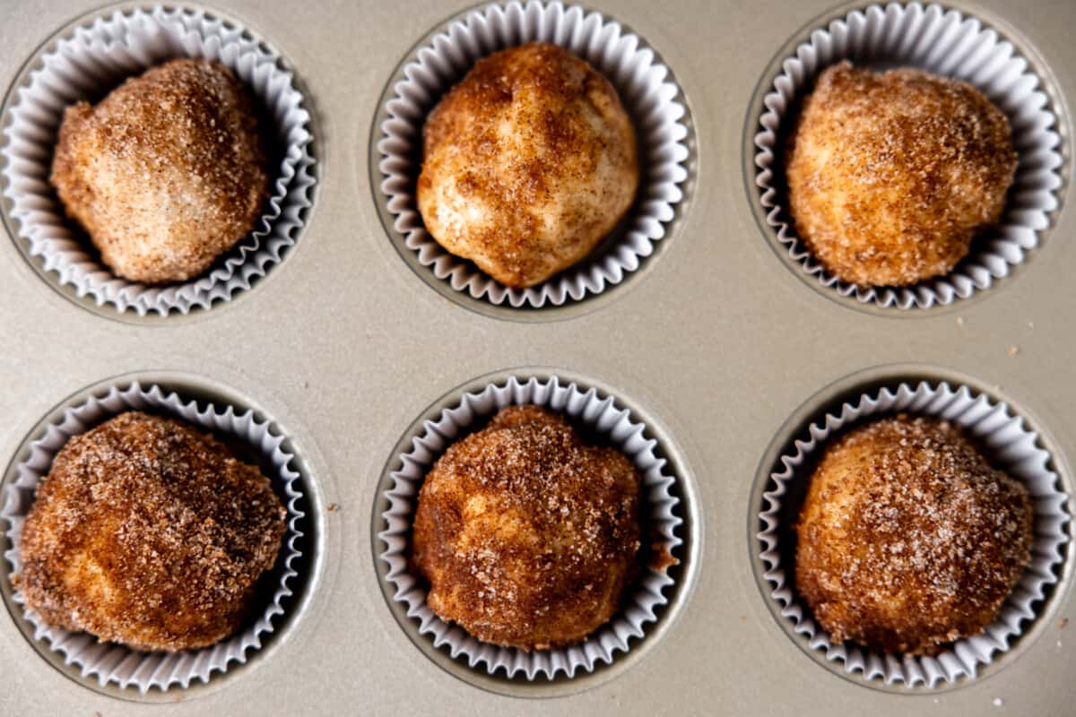 Unbaked resurrection rolls in muffin tin.