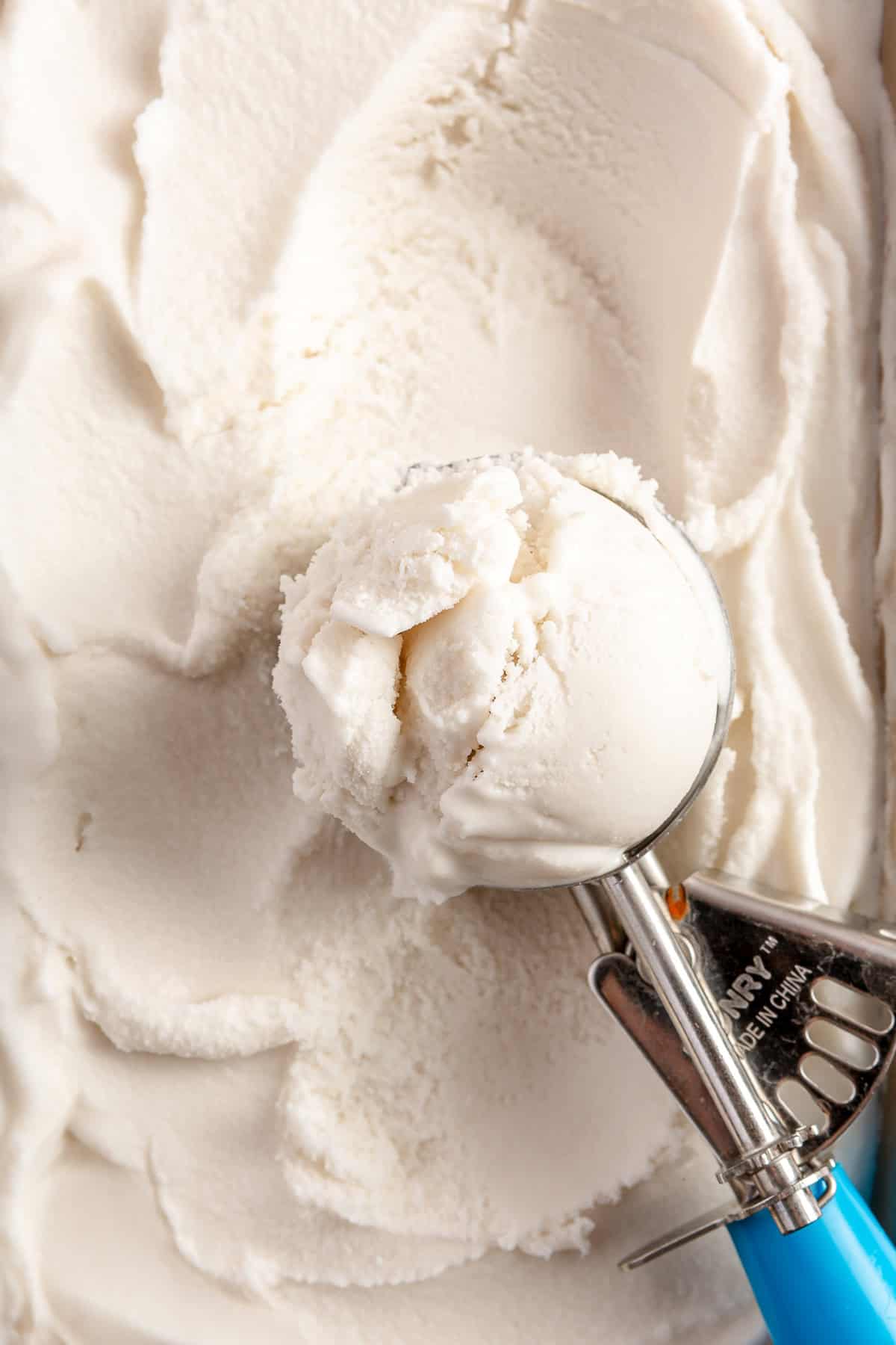 Ice cream scoop serving up coconut sorbet.