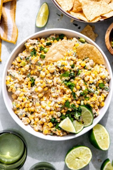 Bowl of Mexican Corn Dip served with tortilla chips.