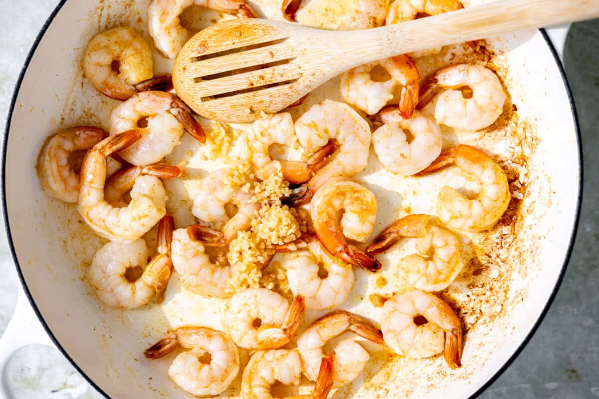 Cooked shrimp in a skillet. 