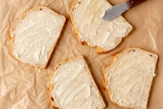 Buttering bread.